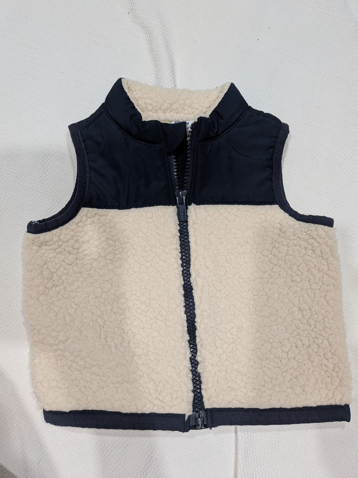 Seller 2. Old Navy vest size 12 months