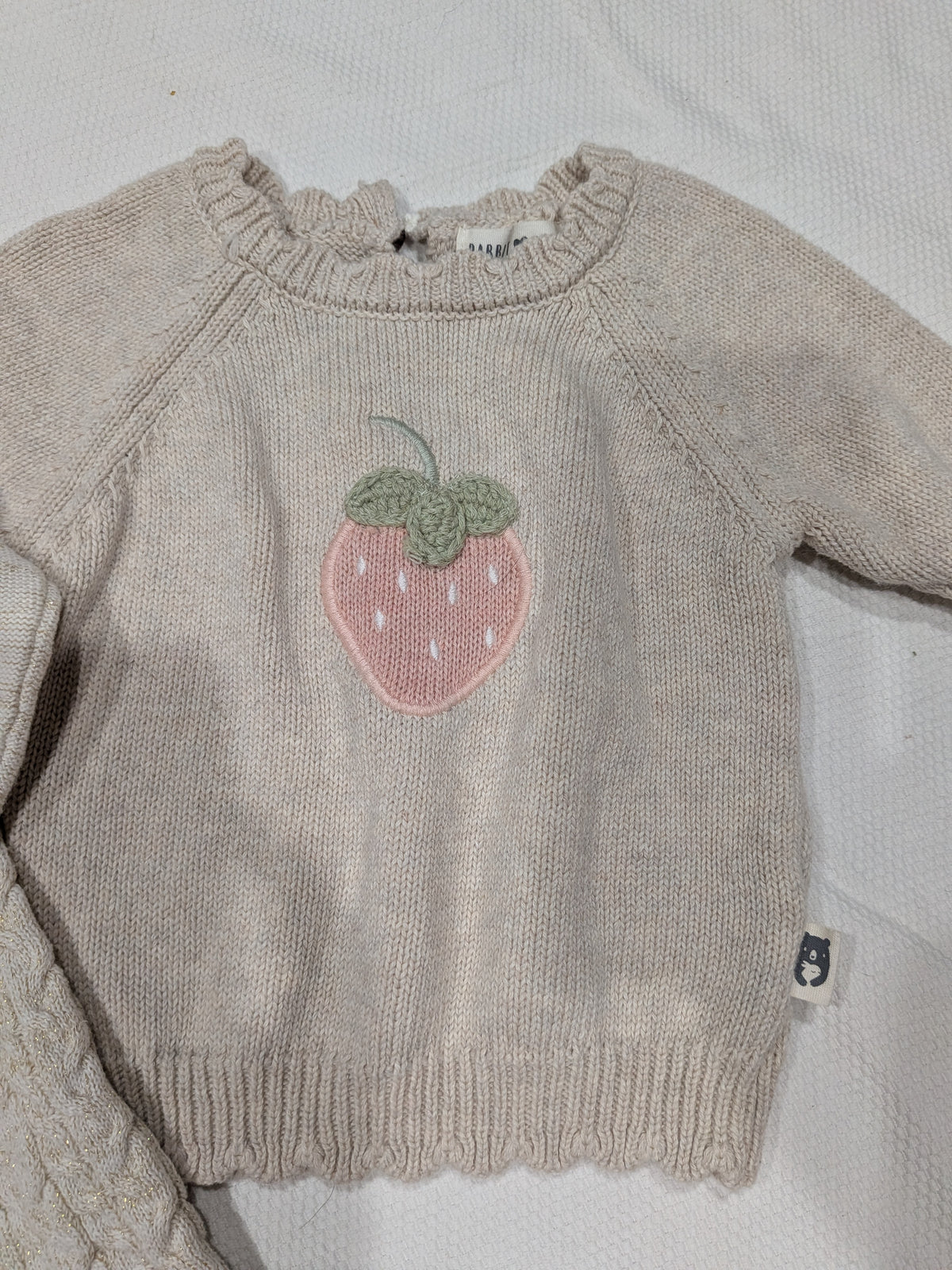 Seller 2. two baby girl sweaters, size 9 months