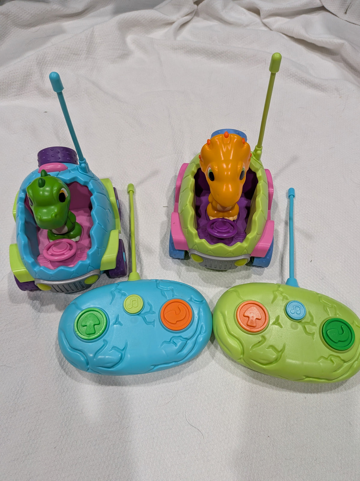 Seller 2. Dino remote control cars with controllers.