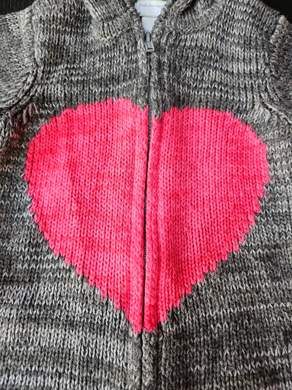 #109. Girls size 18 months. VGUC. First Impressions zip up hooded sweater