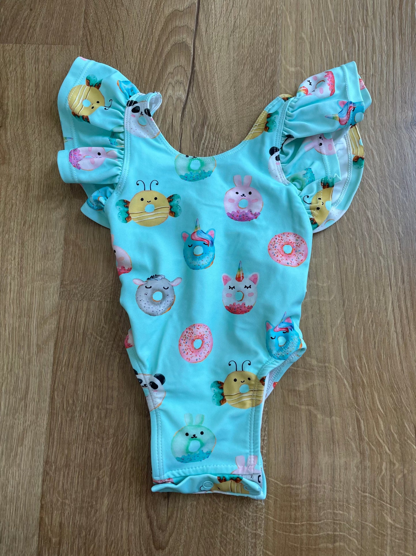 #6 - Posh Peanut Girls Ruffle Swimsuit, 3-6months, teal with donuts