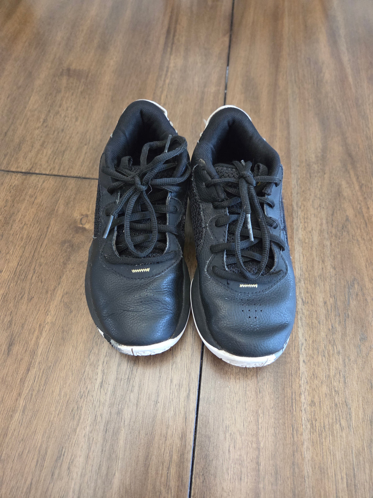 Seller 188 boys UA black and white basketball shoes size 1