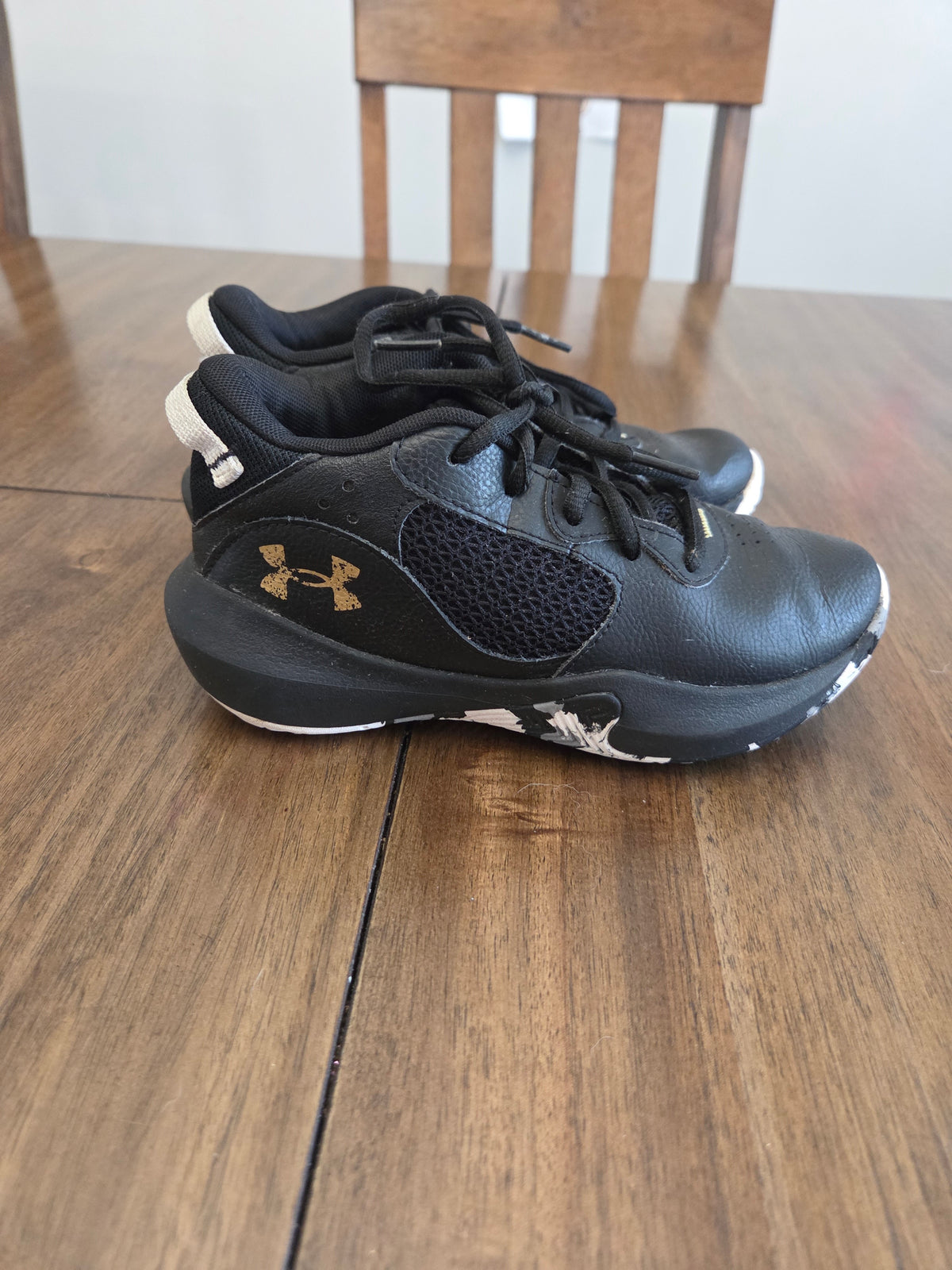 Seller 188 boys UA black and white basketball shoes size 1