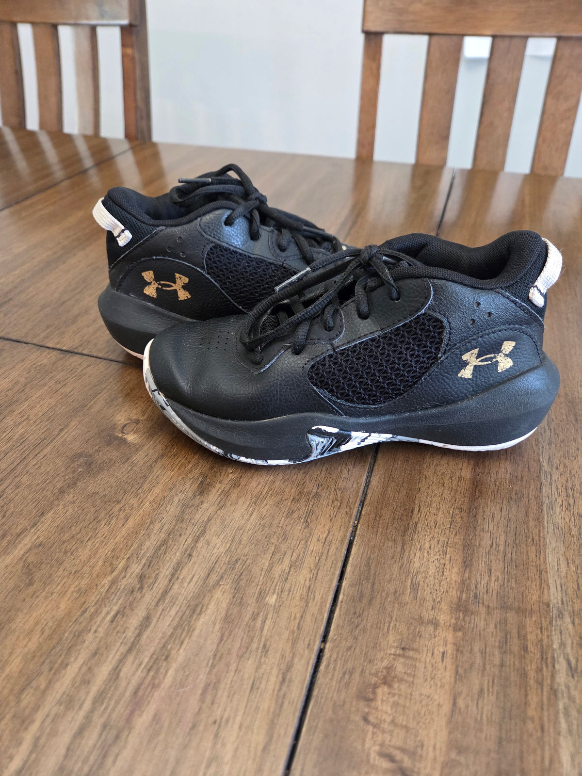 Seller 188 boys UA black and white basketball shoes size 1