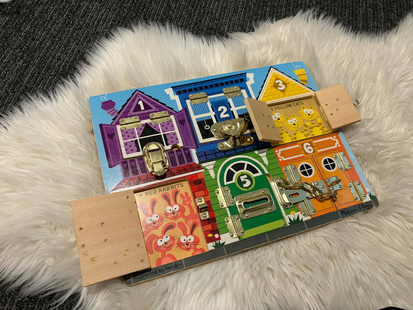 #196 Melissa & Doug Latches Wooden Activity Board