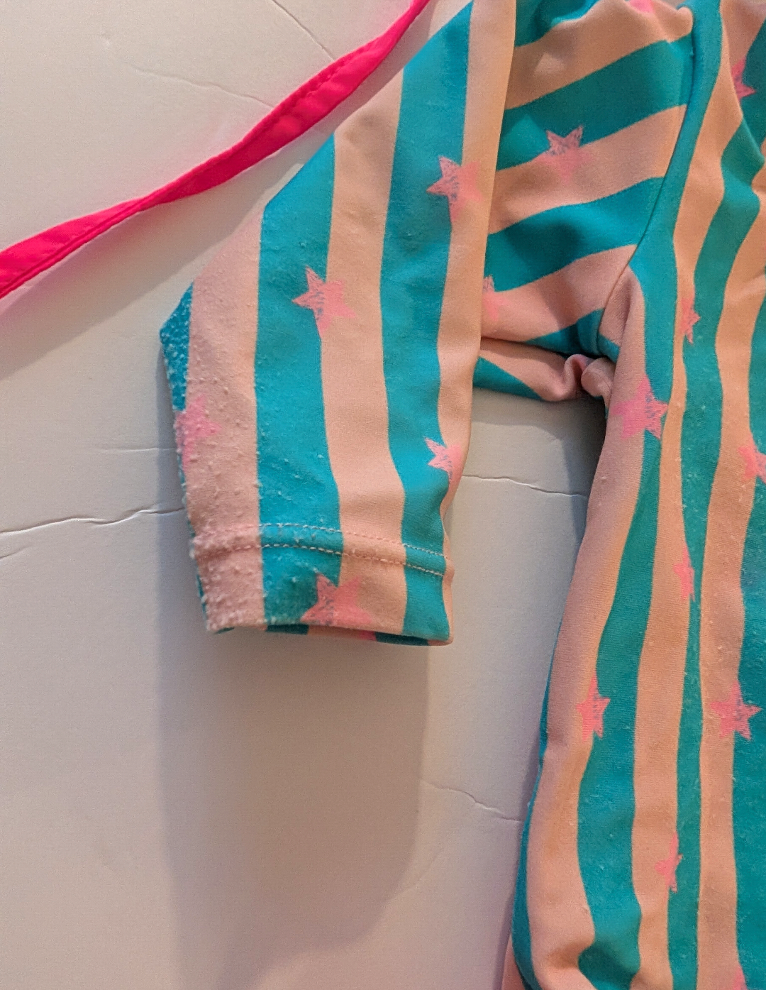 Seller 97, Ruffle Butts Pink & Blue Striped Swimsuit w/Pink Stars & Matching Pink Hat, baby, size 3-6mo (item 217)