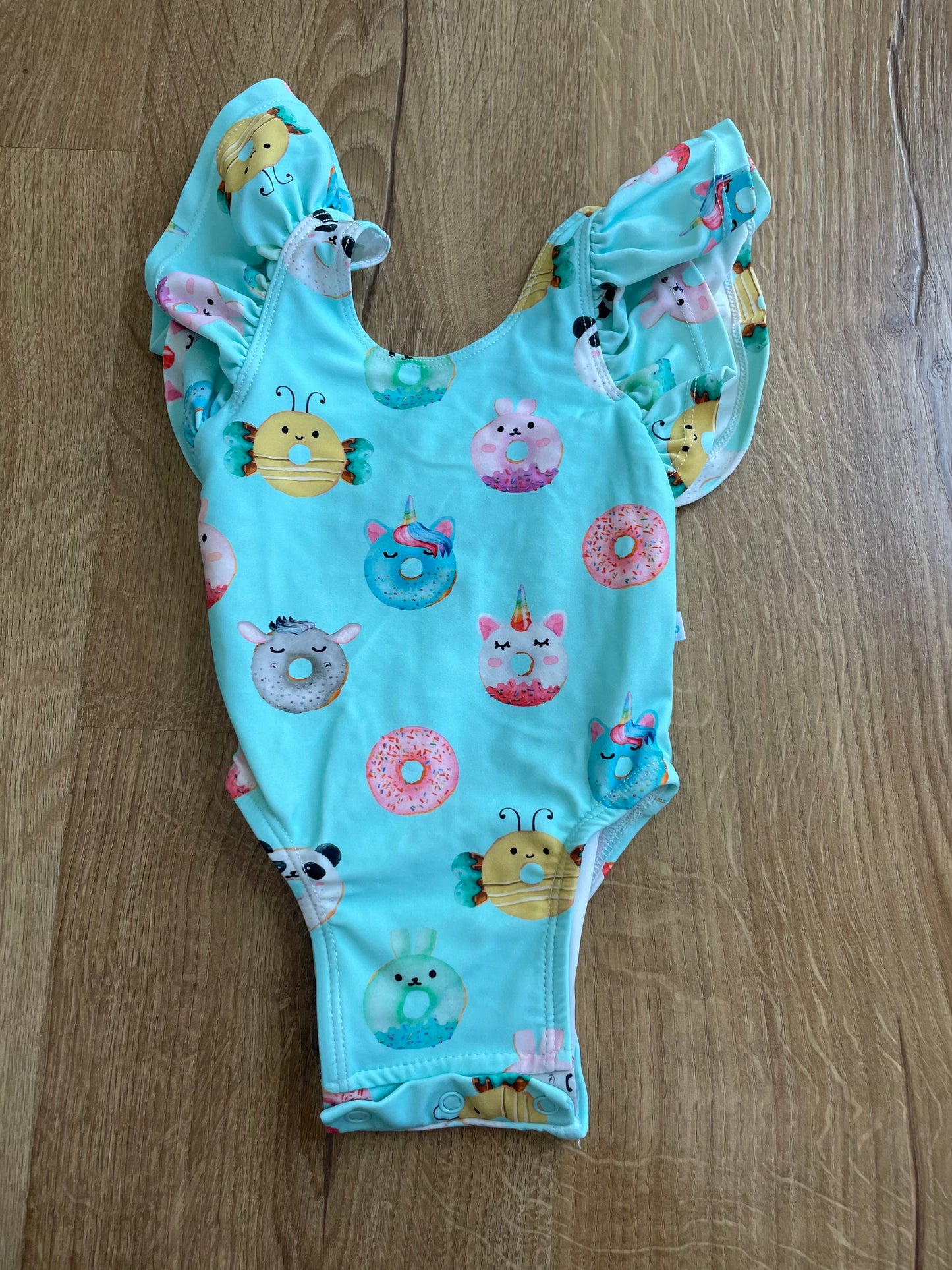 #6 - Posh Peanut Girls Ruffle Swimsuit, 3-6months, teal with donuts