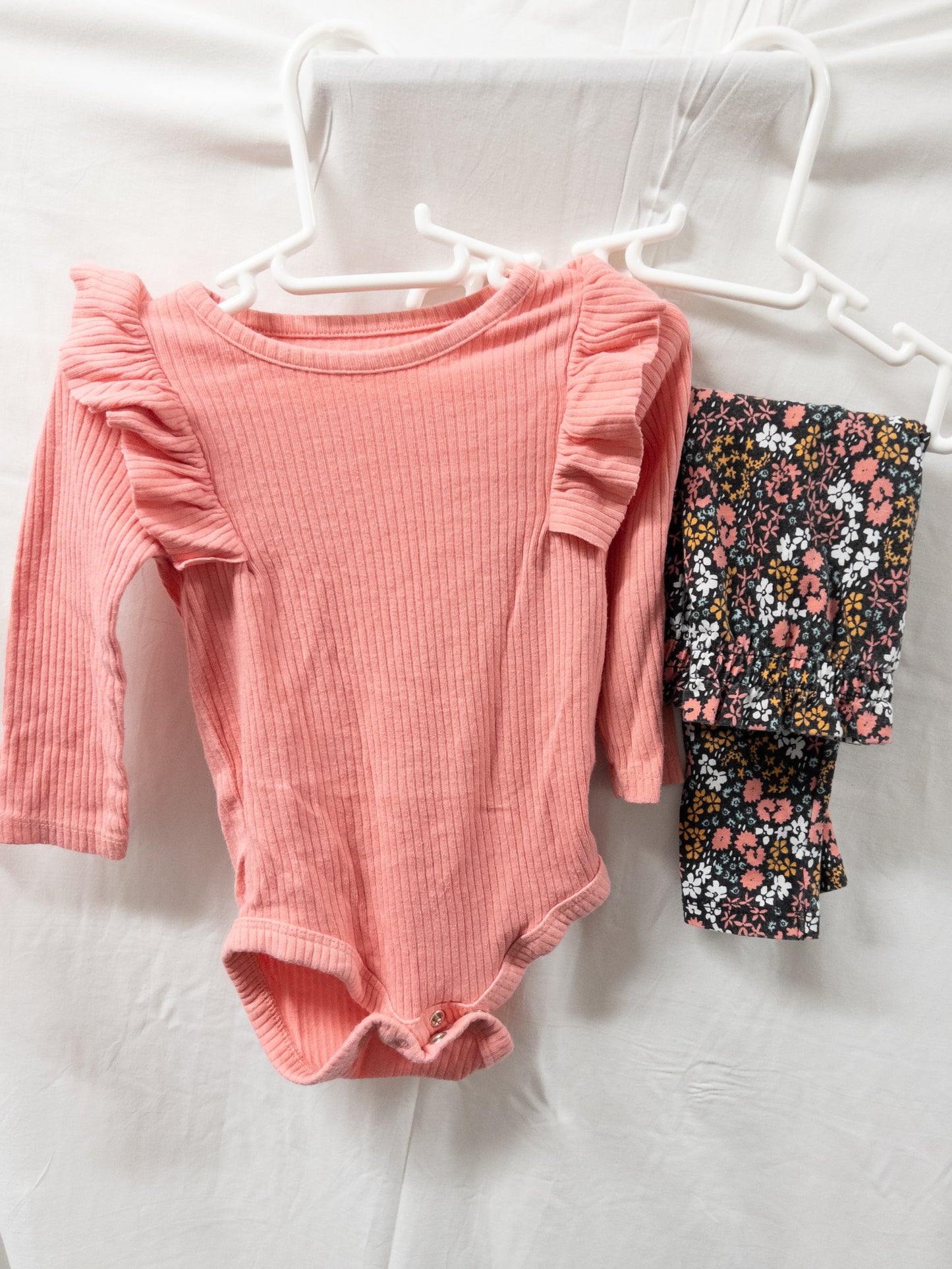 #151 girls 9 month old cat and jack pink outfit with floral ruffled pants.