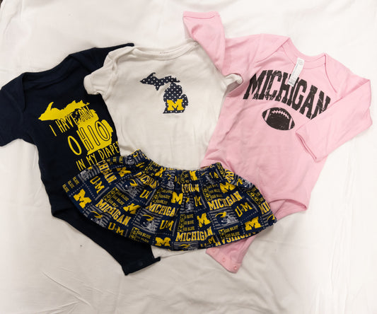 #151 lot of 6-12 month girls Michigan onesies and skirt EUC