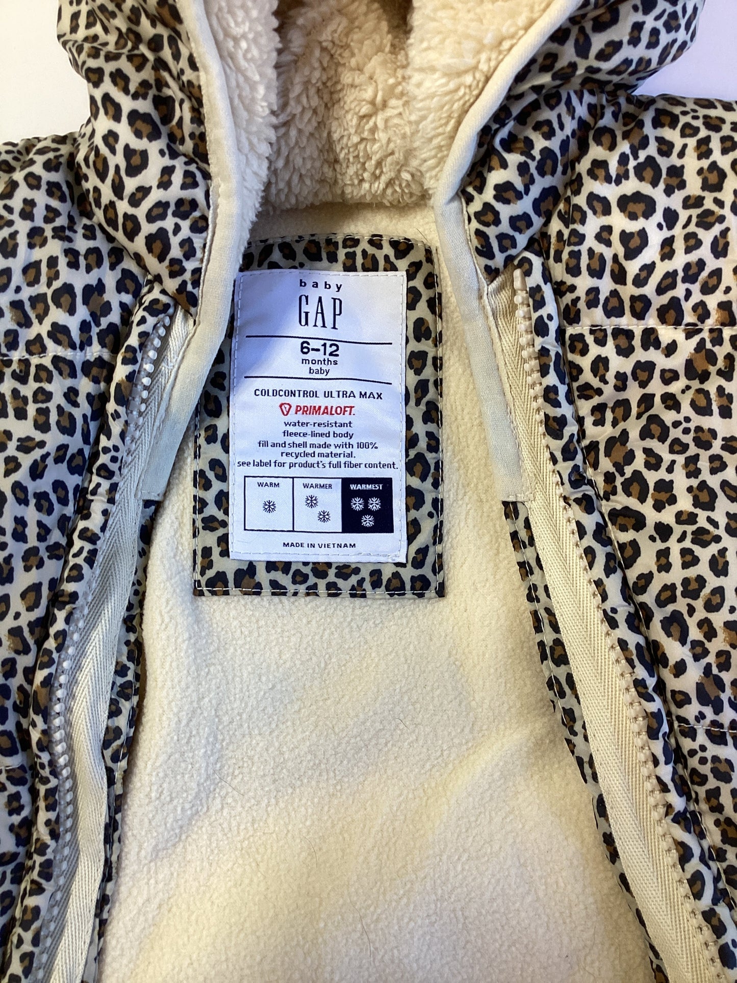 #129 REDUCED Baby gap 6-12 m cheetah snow suit