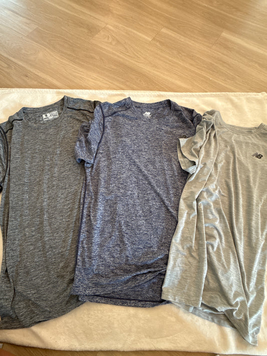 #81 Men tag says large but husband says they run small so more like a medium new balance athletic short sleeve shirts