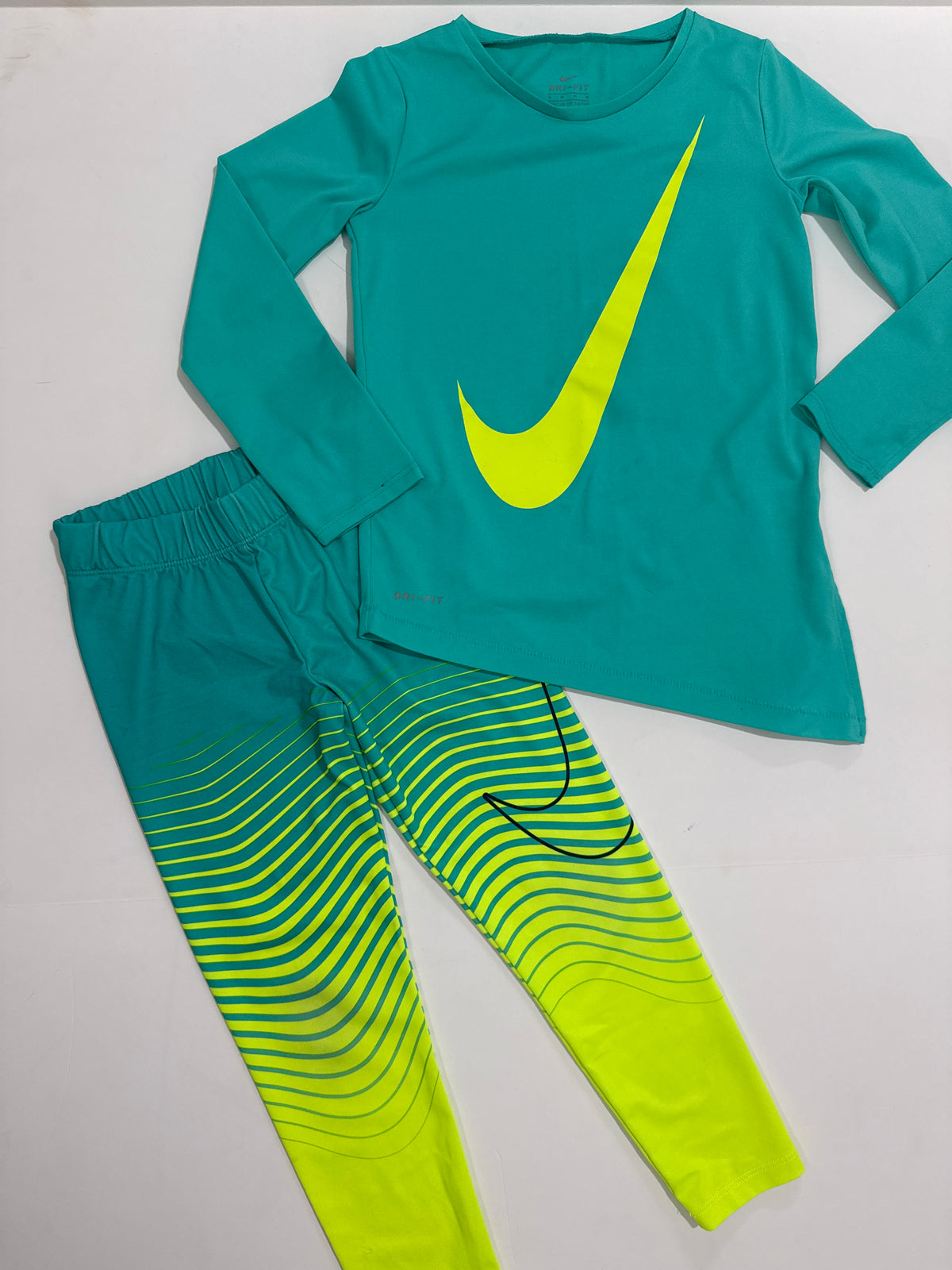 #64 Nike Bright Asymmetrical Top and Leggings Set Size 6