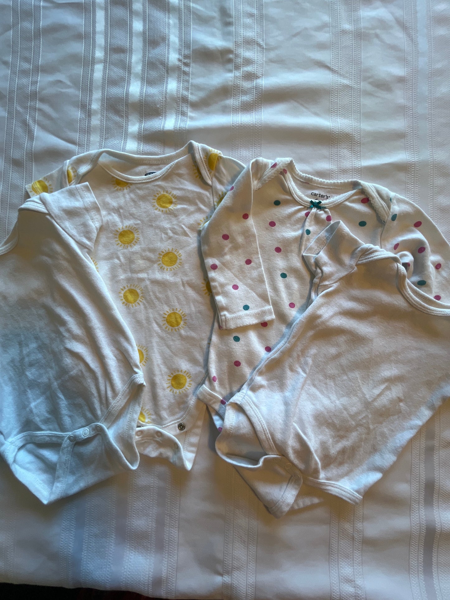 #57  Girls 6-12 mo onesies set of 4 EUC