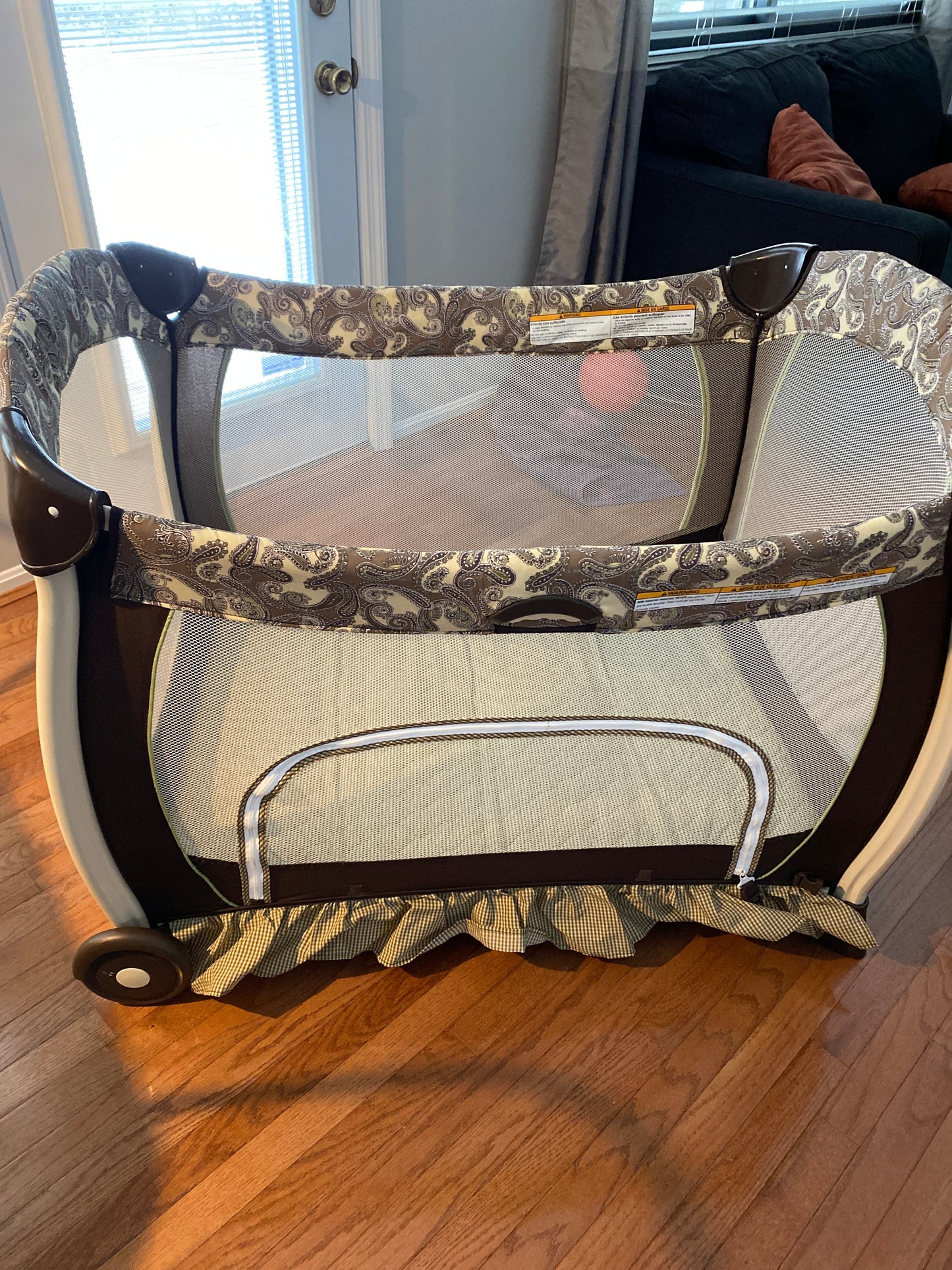 Seller #86 *REDUCED* Graco Pack n Play (brown and green paisley)