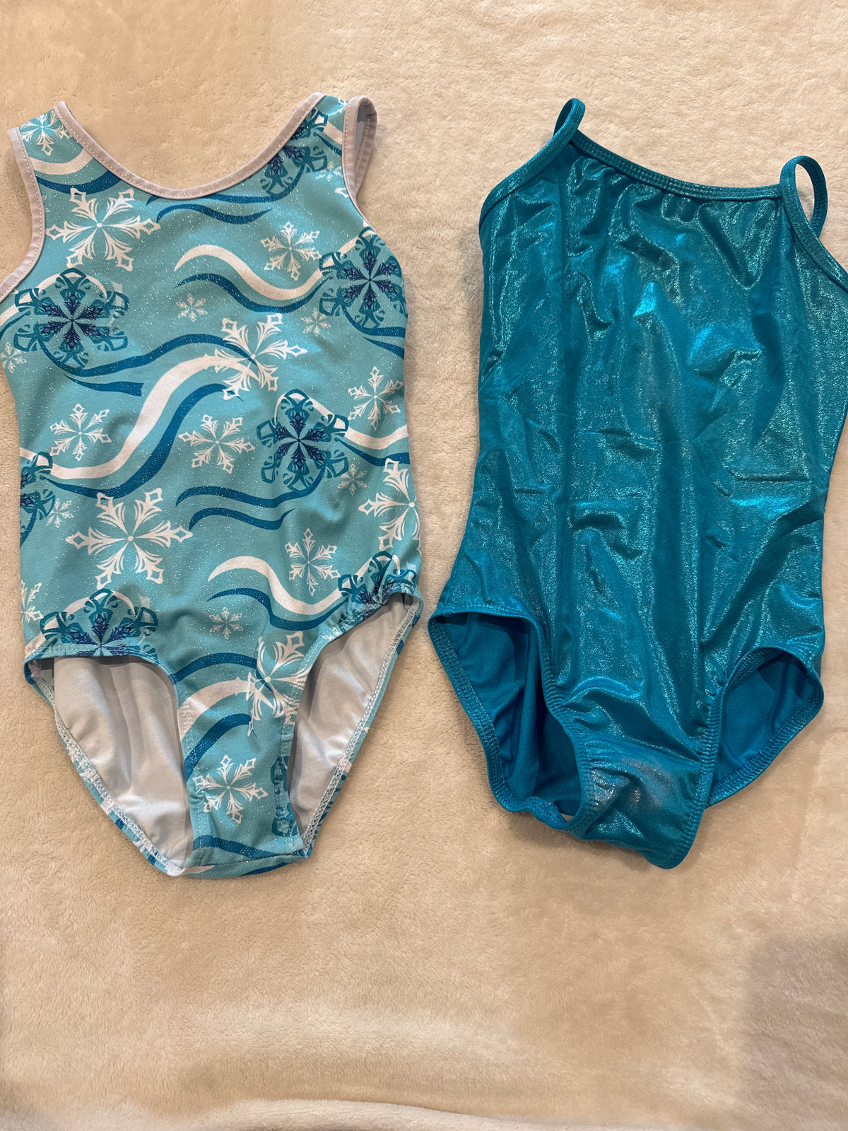 #81 Girls 6 Blue leotard (says 8-10 lines up with my 6s though) and frozen leotard both euc