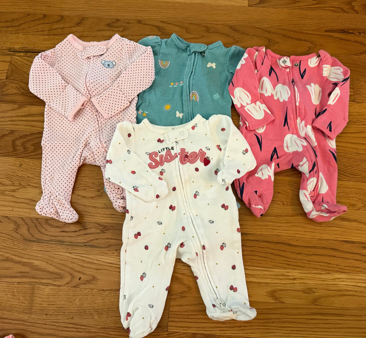 Seller #152 - set of 4 Carter's newborn footed pajamas