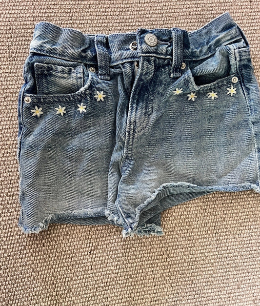 Old Navy jean shorts with daisy embroidery, size 7