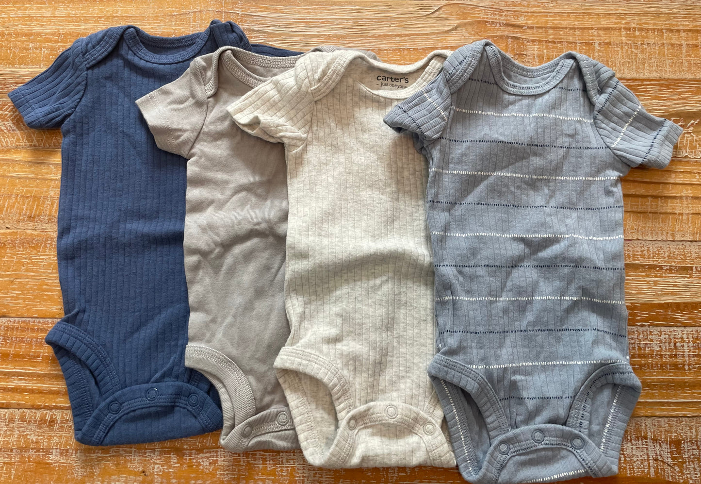 Seller #3 Carter's Boys Newborn Onesies (four)