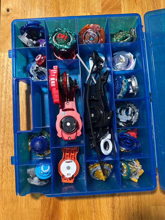 #186 Large Collection of Beyblades + Carrying Case