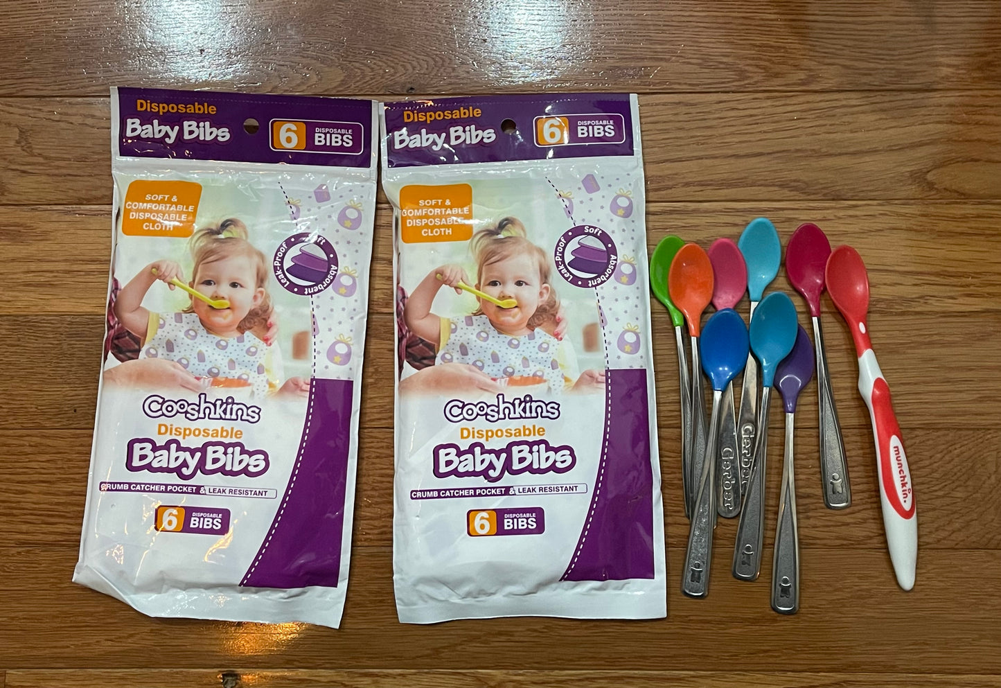 Baby 12 disposable bibs and infant spoons