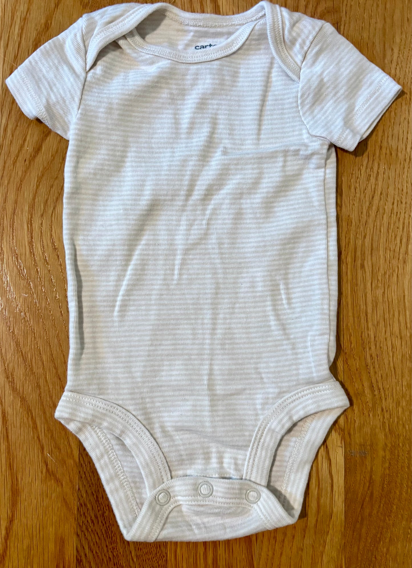 Seller #64 Carter’s 3M Gender Neutral Onesies set of 4