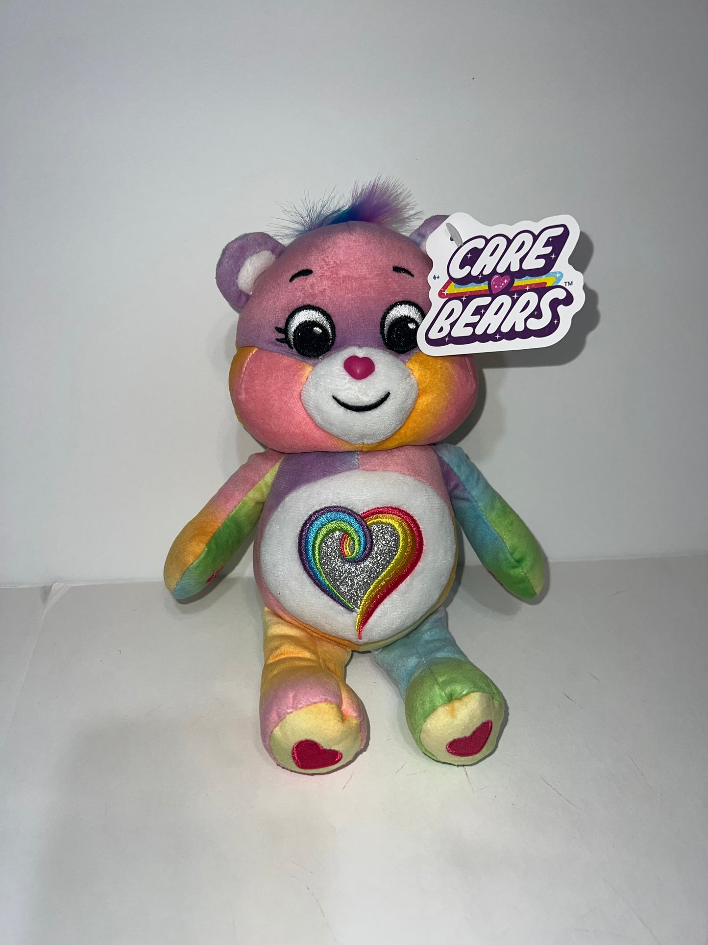 #78 NWT rainbow heart care bear