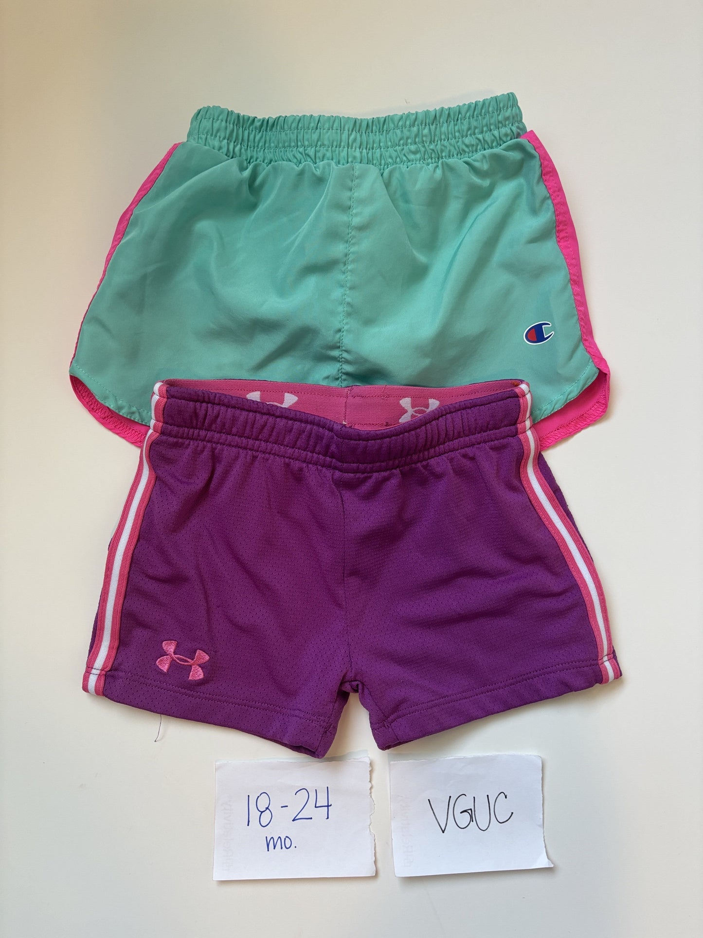 #77 - 18-24 Mo - VGUC Champion + Under Armour - 2 Pair Shorts (Teal + Purple)