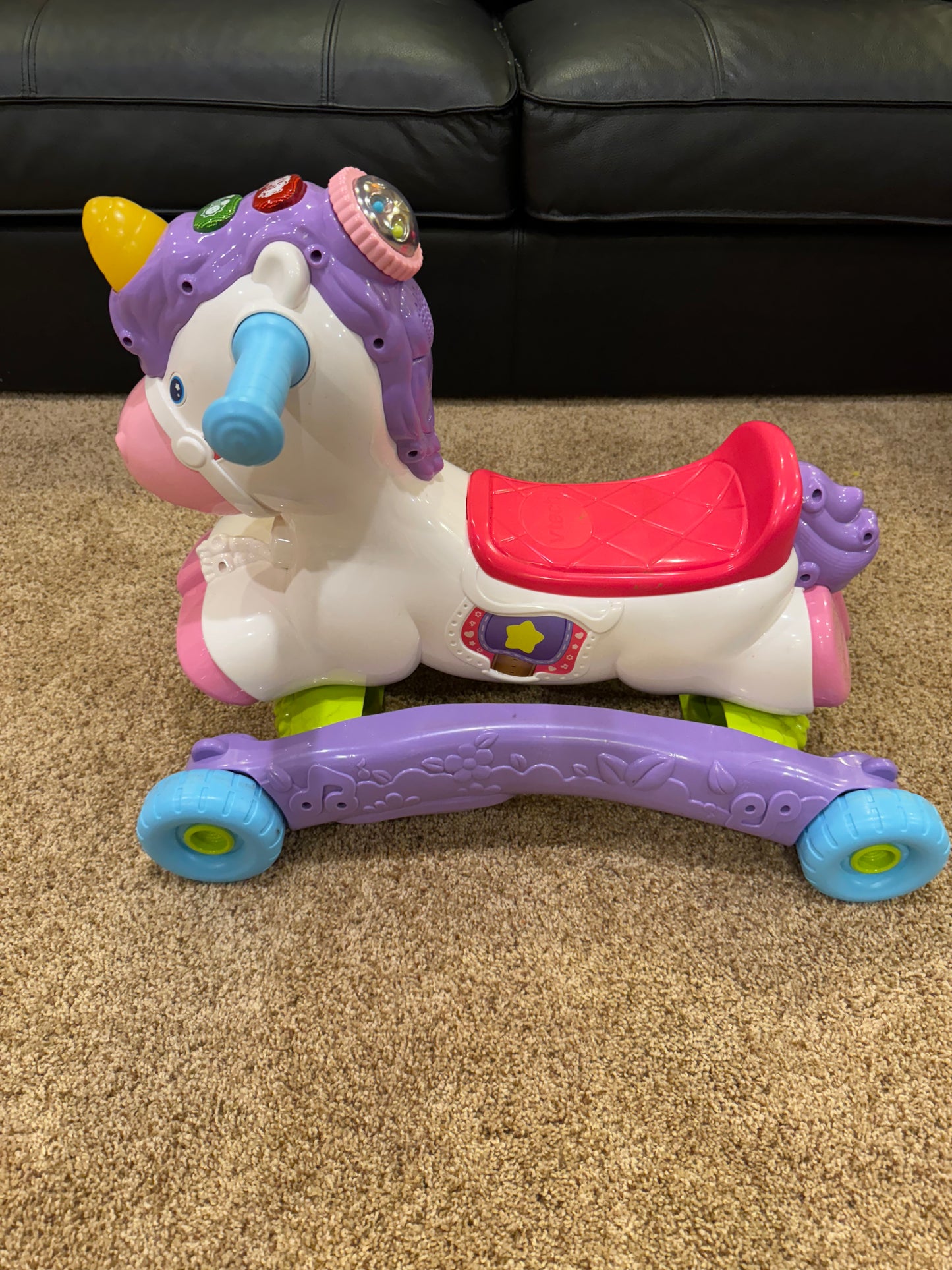 #86A unicorn ride on toy, also wheels flip to be a rocker