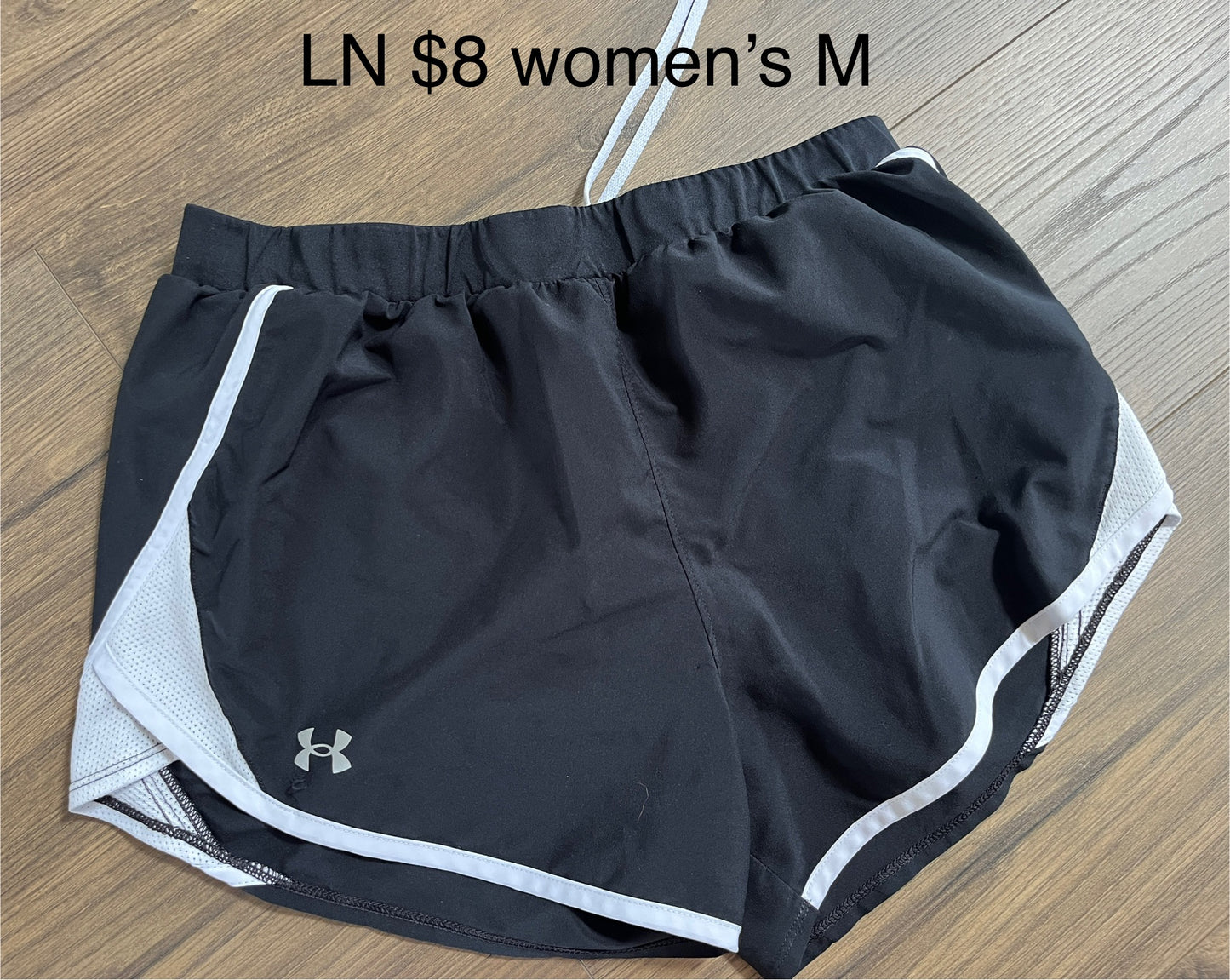 137 2 Pairs of Women's Under armour shorts Black and white Size M (MULTIPLE PICS)