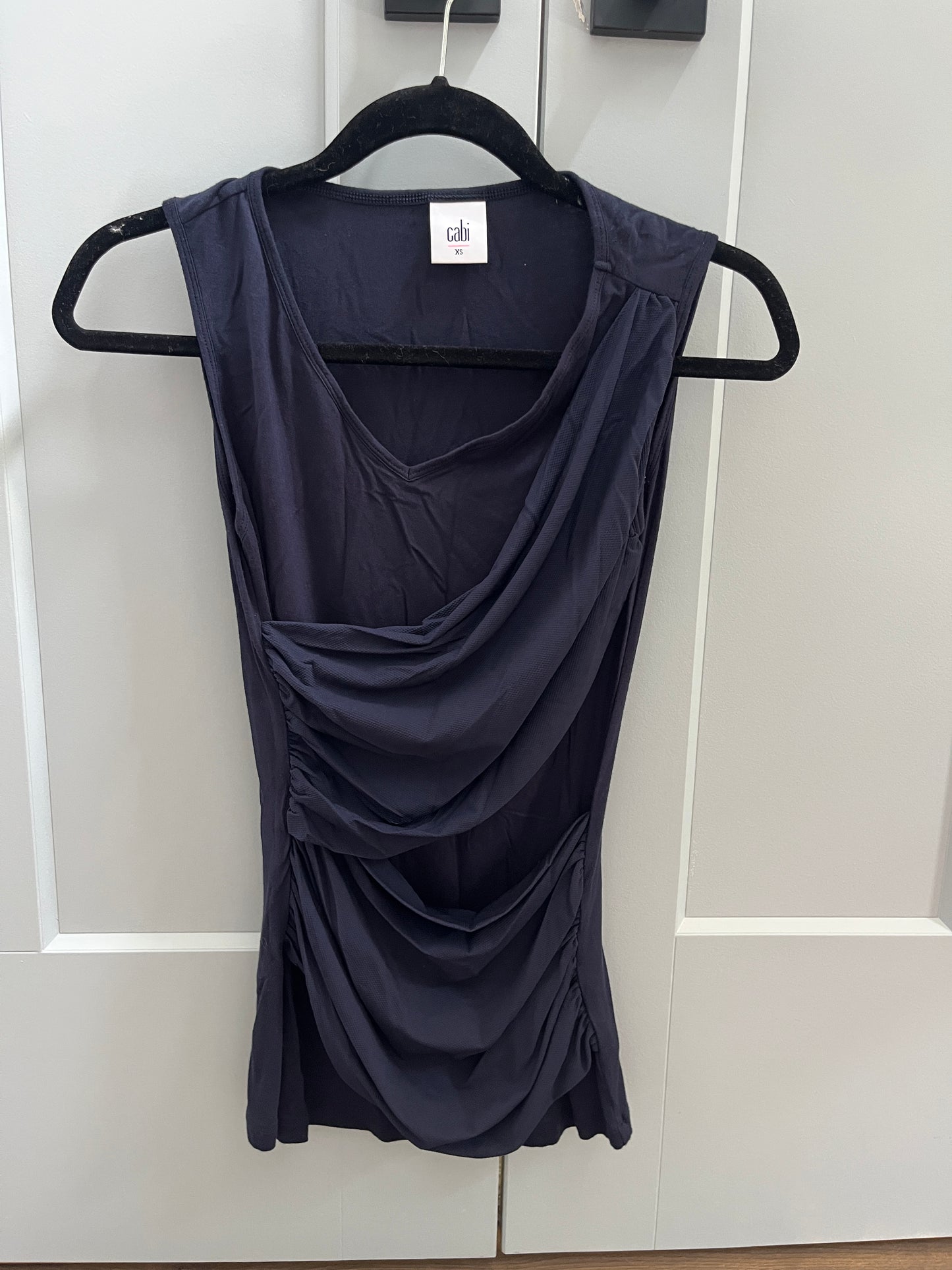 137 (2 shirts) Cabi Navy sleeveless cross over navy shirt and off white sleeveless Ann Taylor loft lace shirt Both XS, LN