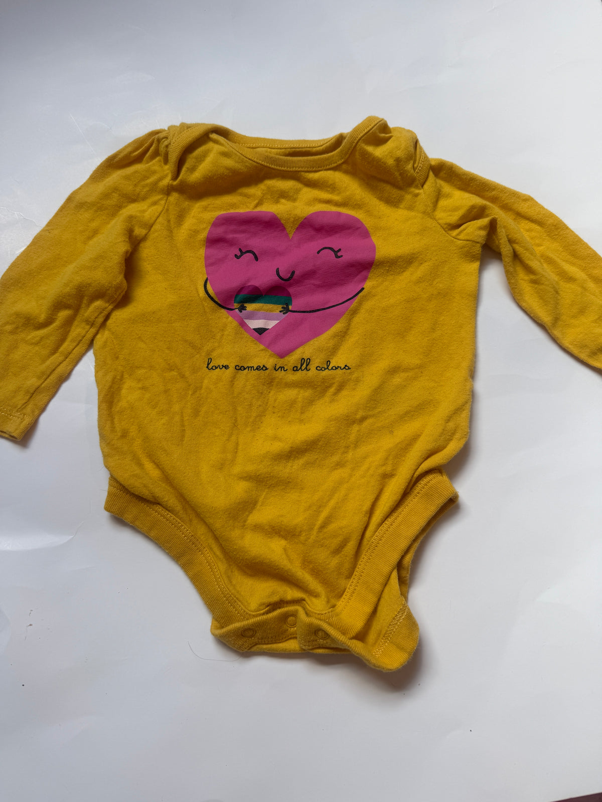 #170 Gap yellow body suit “Love comes in all colors “ heart girls 6-12 months