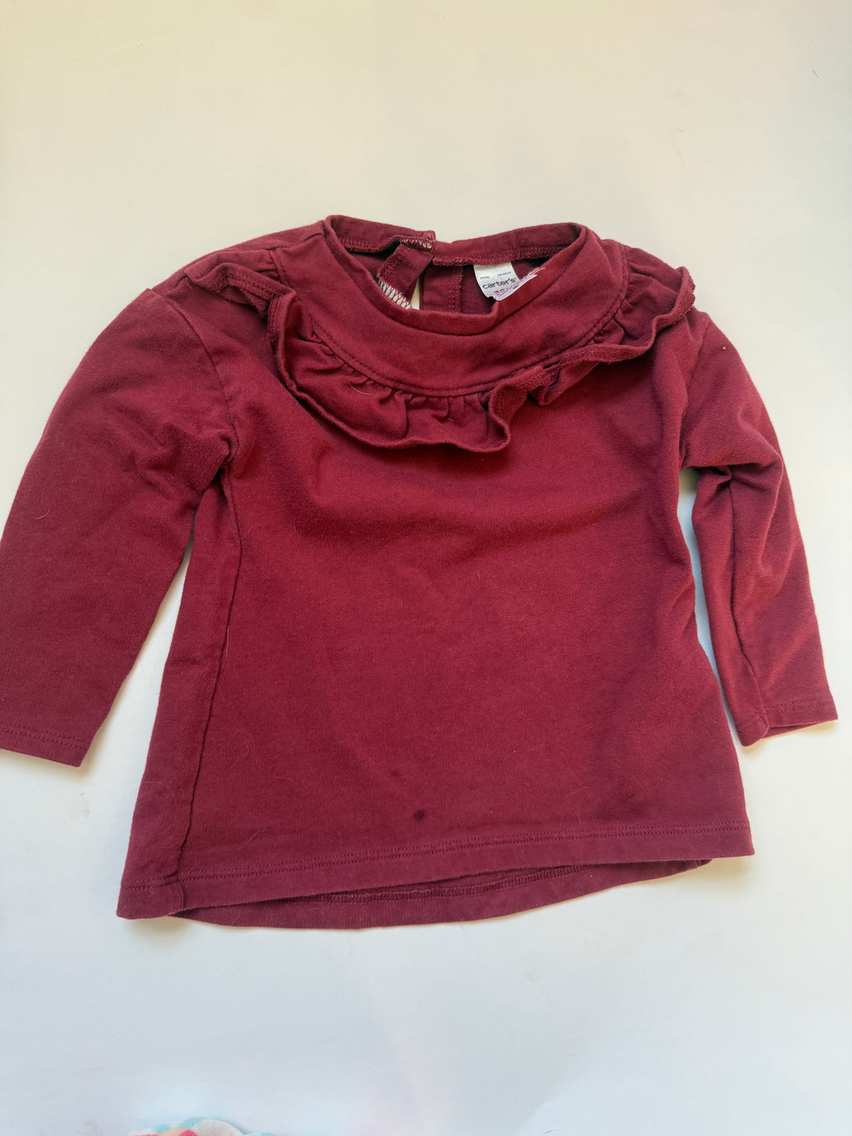#170 Carters tops bundle (3)—pink with white polka dots and white little pockets, burgundy top with ruffle neck and fleece printed vest girls 18 months