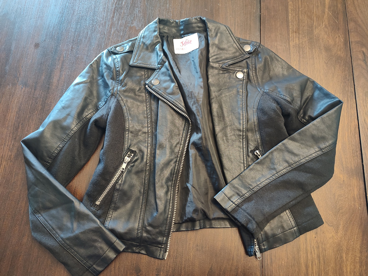 Seller 185:  Justice size 12 black zipup faux leather jacket