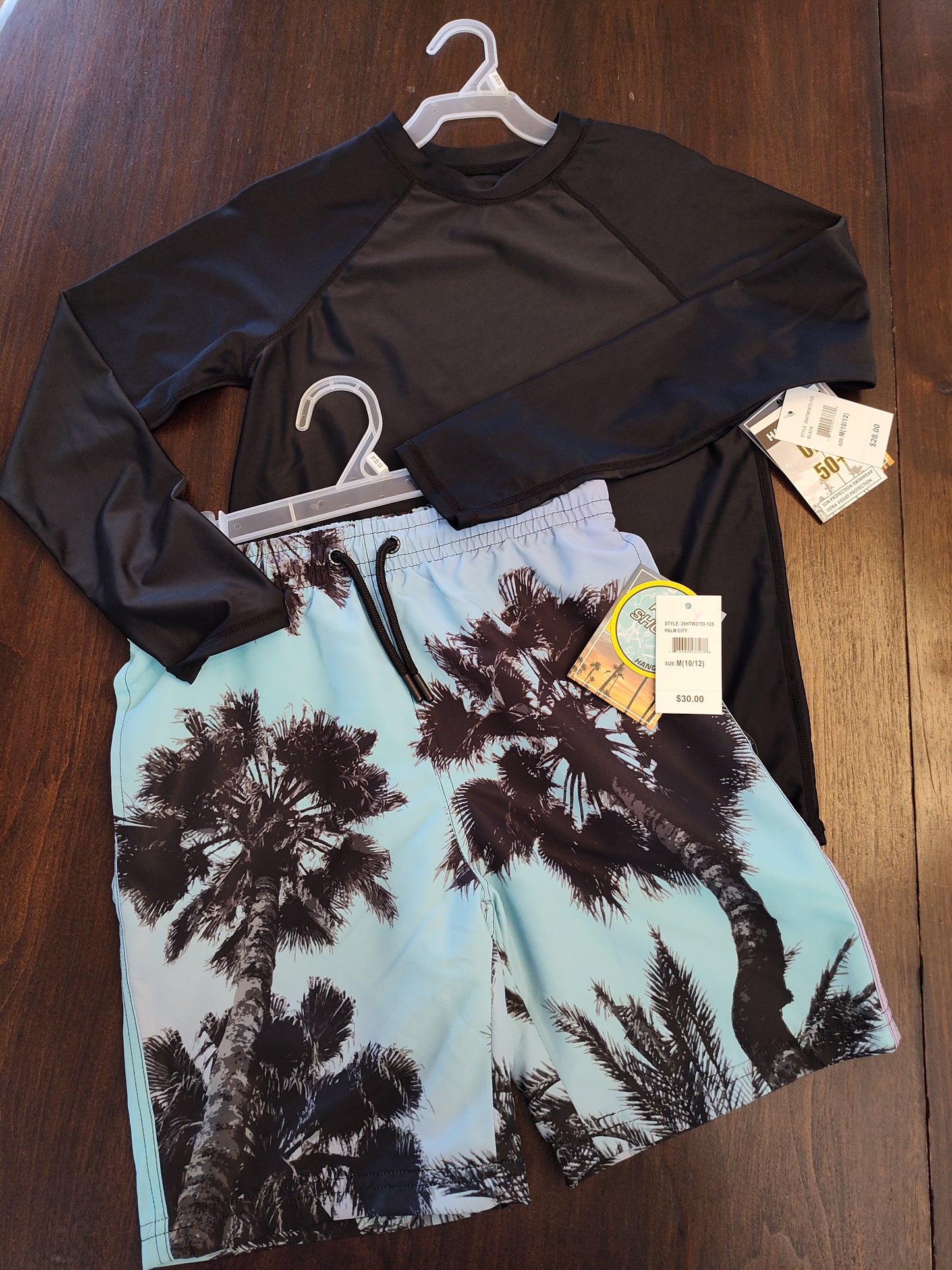 Seller 185:  Boys size 10/12 New swim trunks and Rash Guard