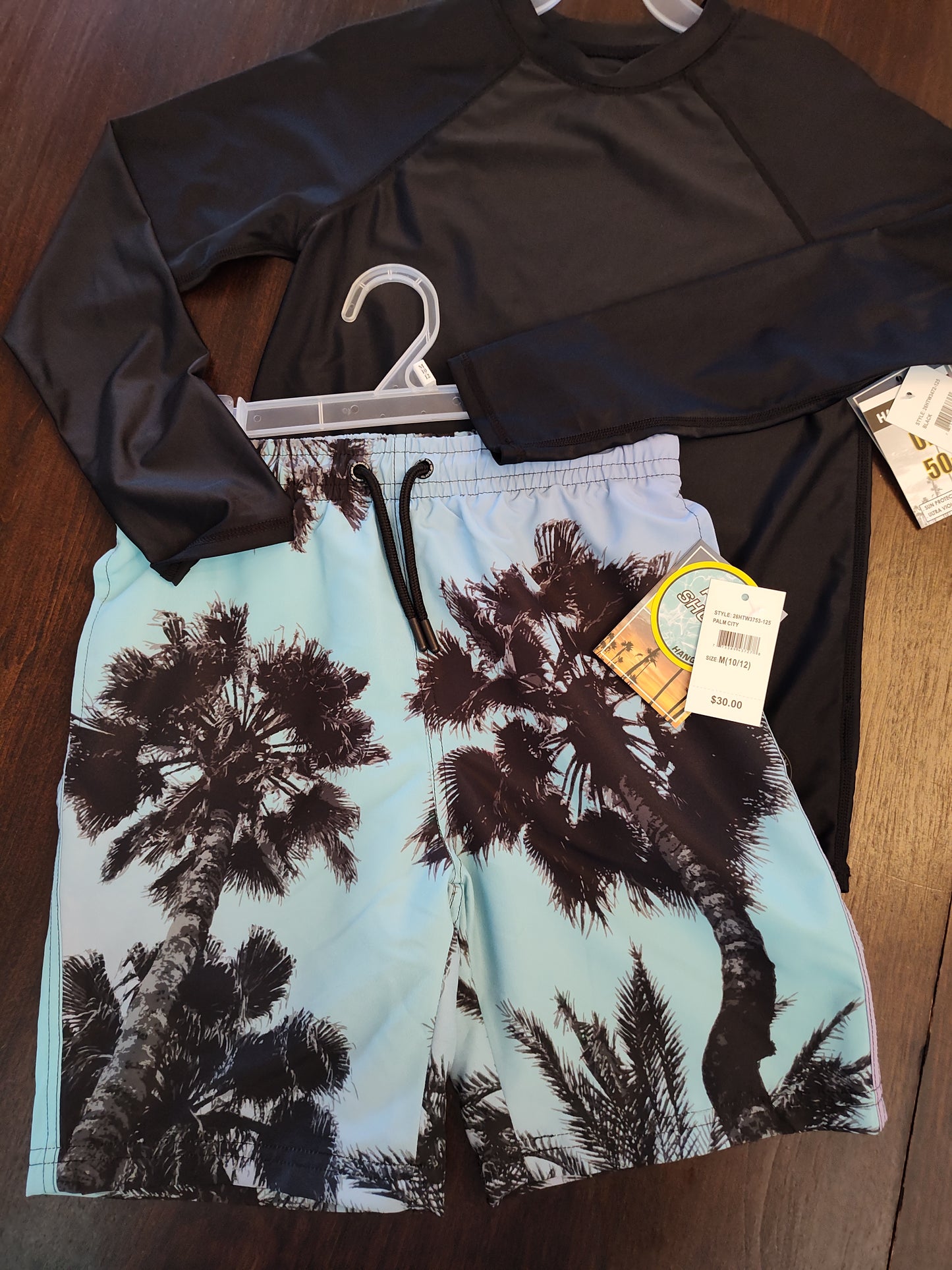 Seller 185:  Boys size 10/12 New swim trunks and Rash Guard