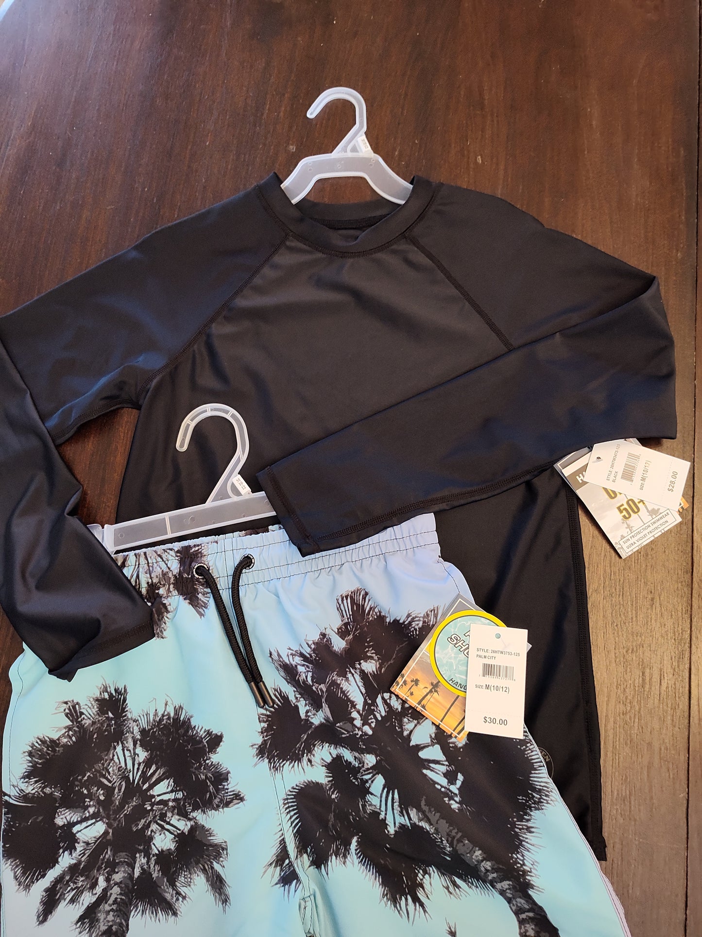 Seller 185:  Boys size 10/12 New swim trunks and Rash Guard