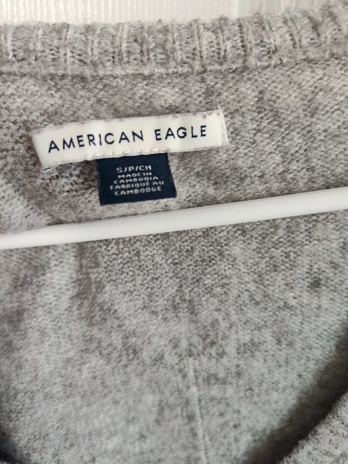 Seller 189:  American Eagle V-neck sweater Women's size small grey/bow detail