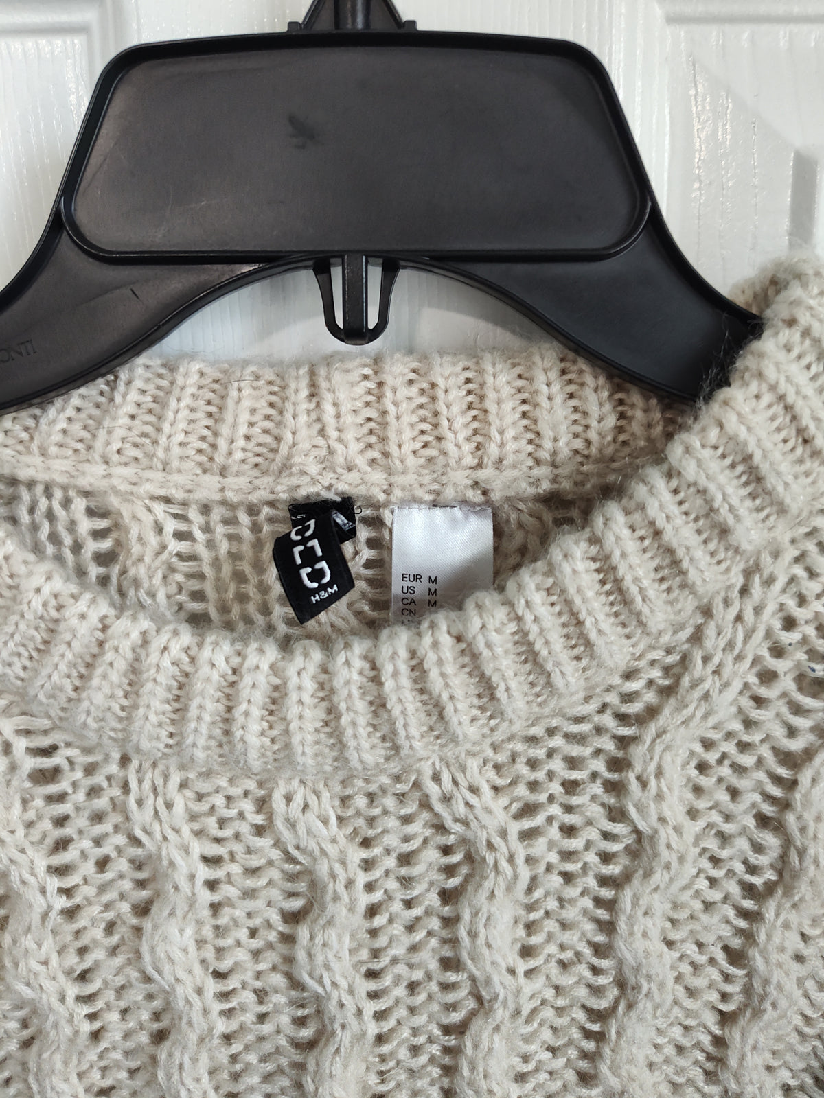 Seller 189:  Divided beige sweater women's size medium