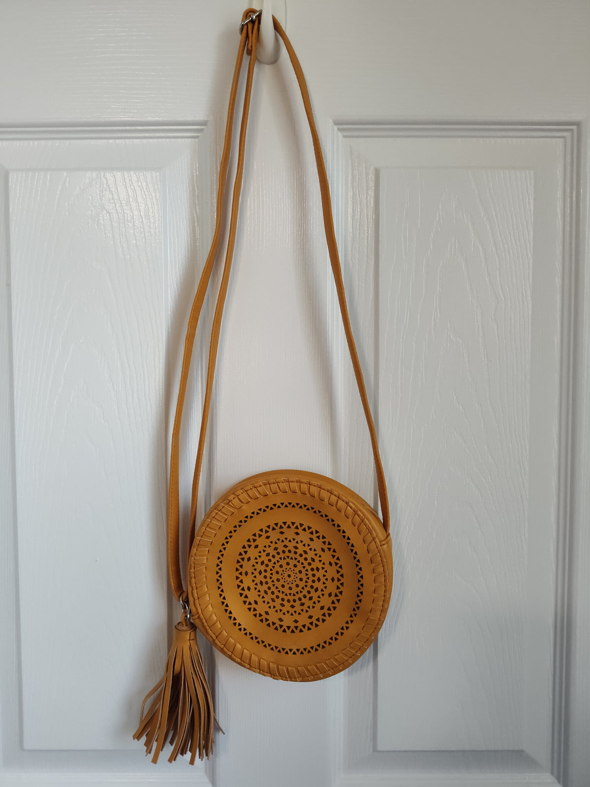 Seller 189:  Girl's mustard color round purse