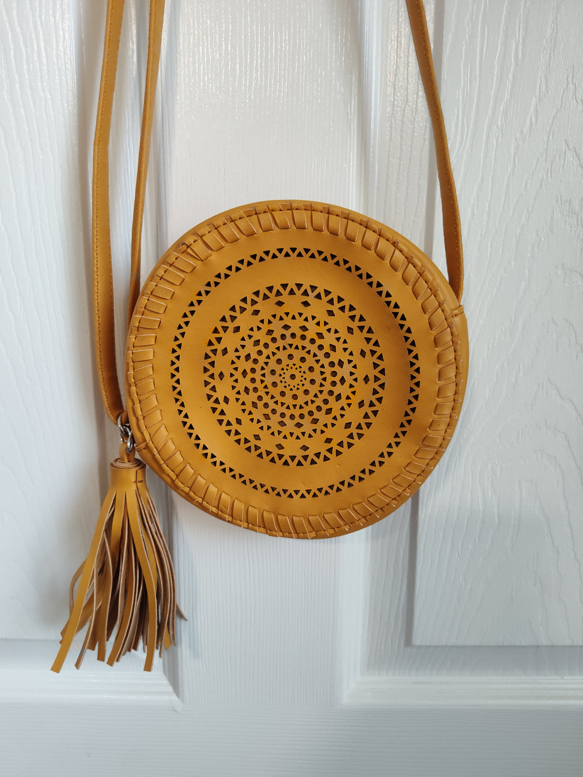 Seller 189:  Girl's mustard color round purse