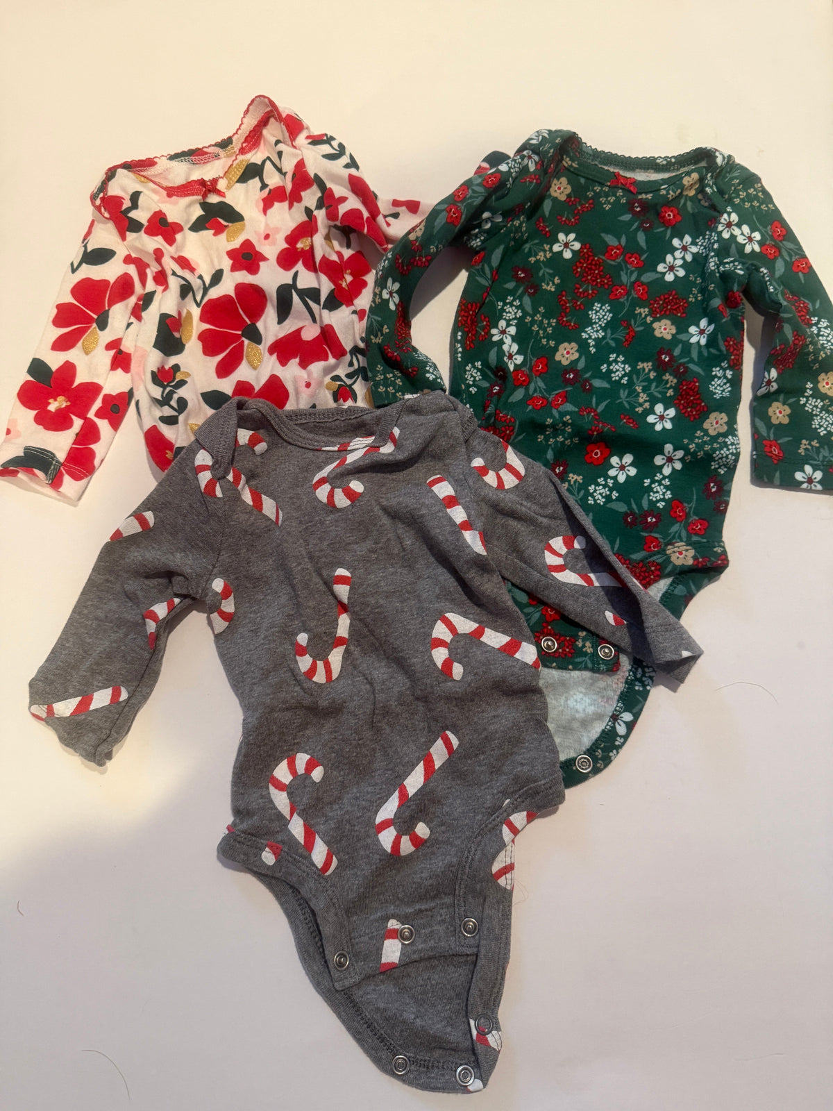 #170 Carters holiday body suit long sleeve bundle (3)-gray with candy canes, cream  with red green and cold flowers and green with red flowers girls 3 months