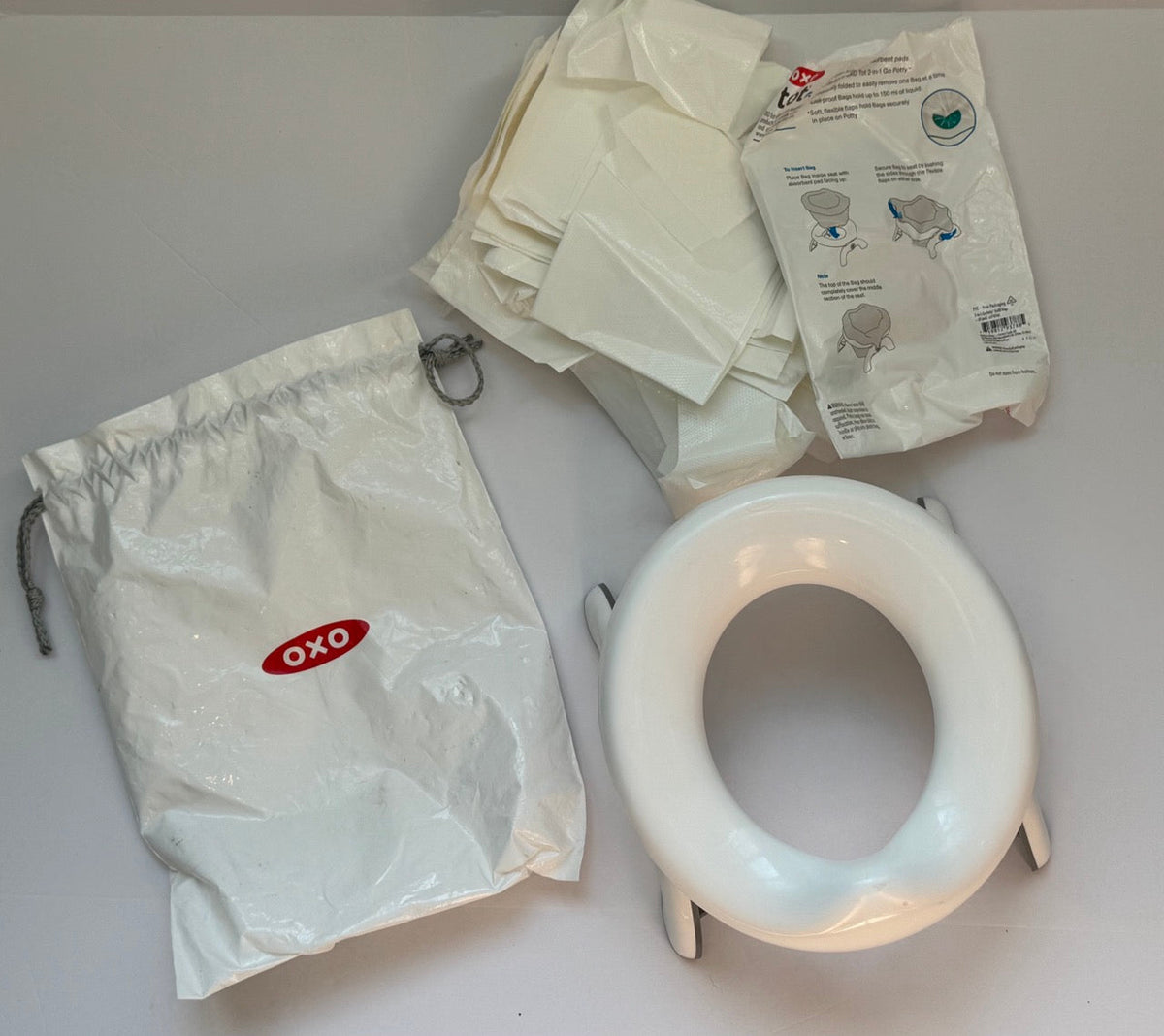 #82 OXO Tot 2-in-1 Go Potty With Disposable Potty Liners (2+ packages)