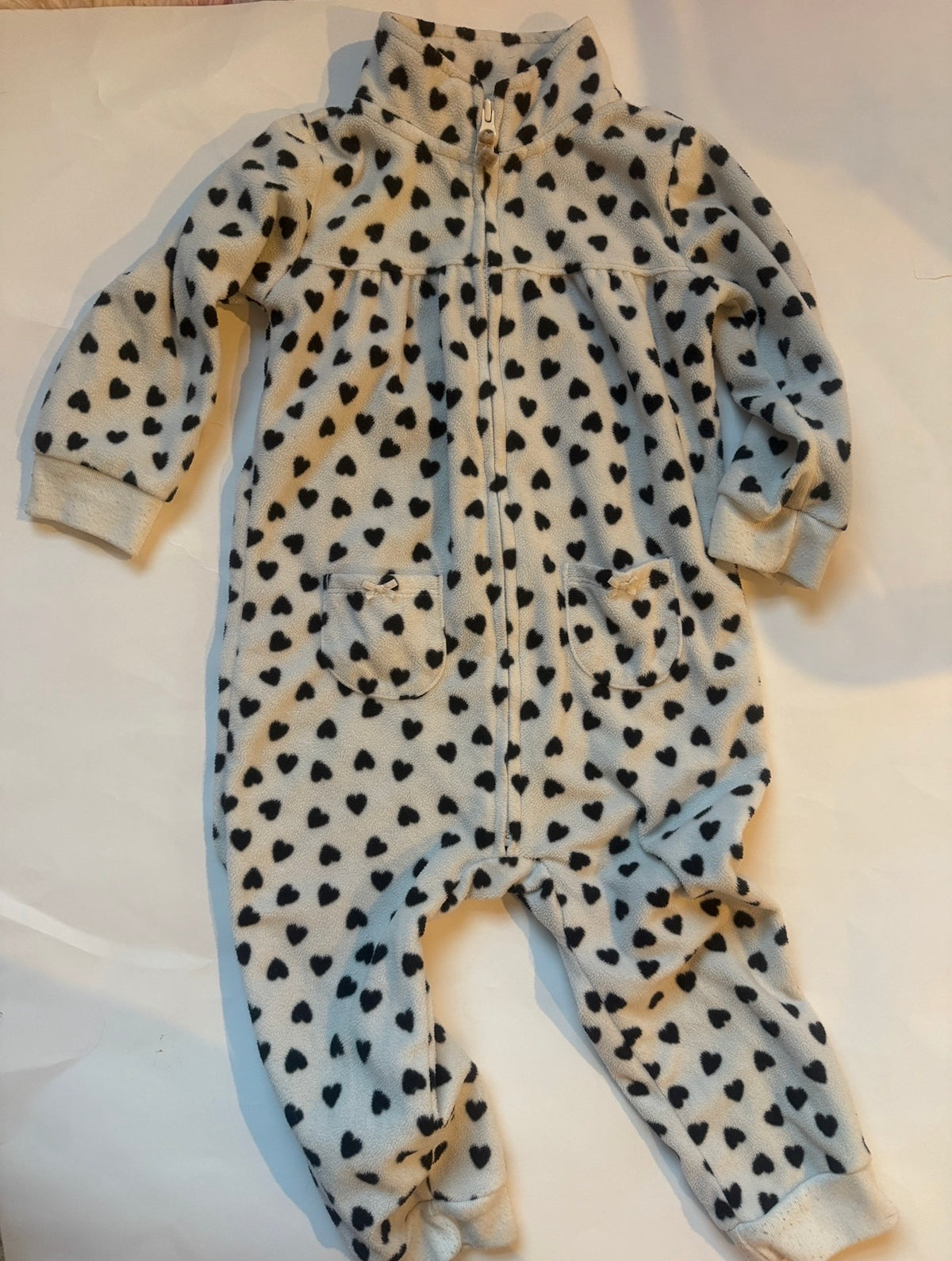 #170 carters pajama bundle (3)— fleece cheetah print “love” zip non foot pj, fleece white with black hearts and pockets and 2 piece cocoa helps me sleep monkey pjs girls 18 months
