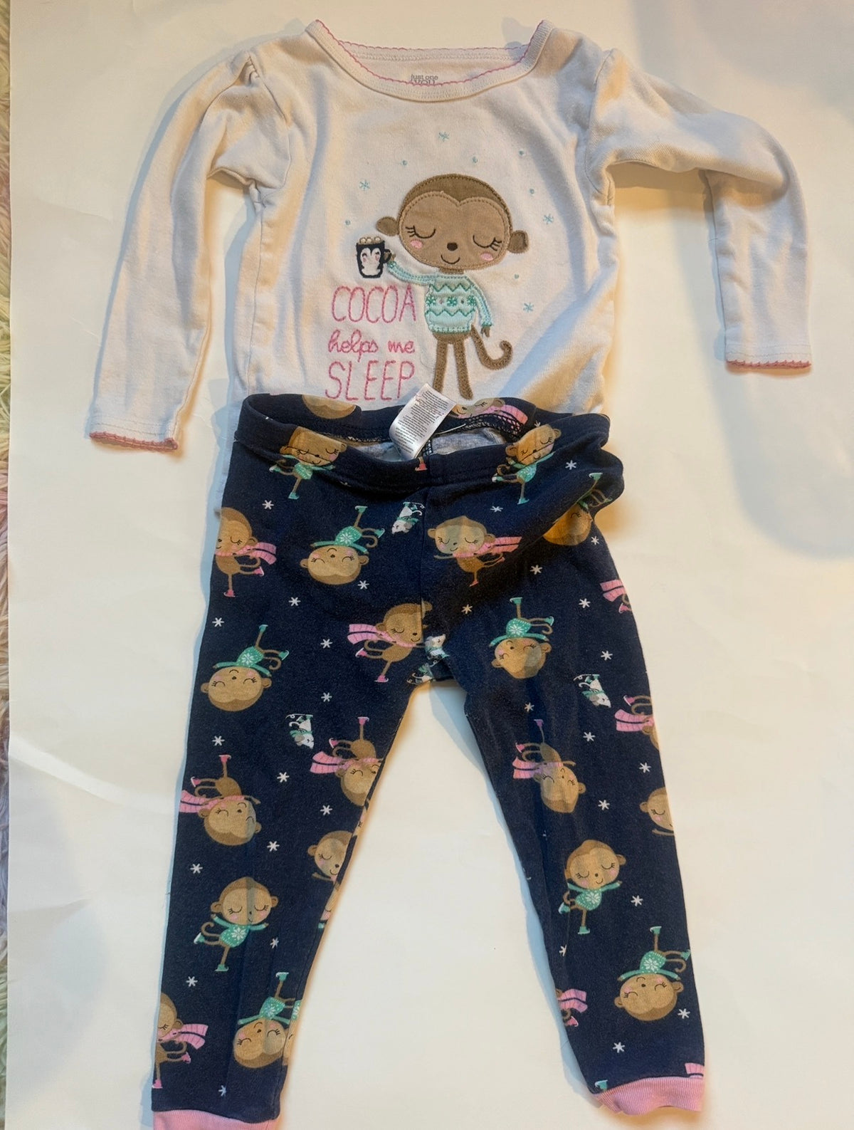 #170 carters pajama bundle (3)— fleece cheetah print “love” zip non foot pj, fleece white with black hearts and pockets and 2 piece cocoa helps me sleep monkey pjs girls 18 months