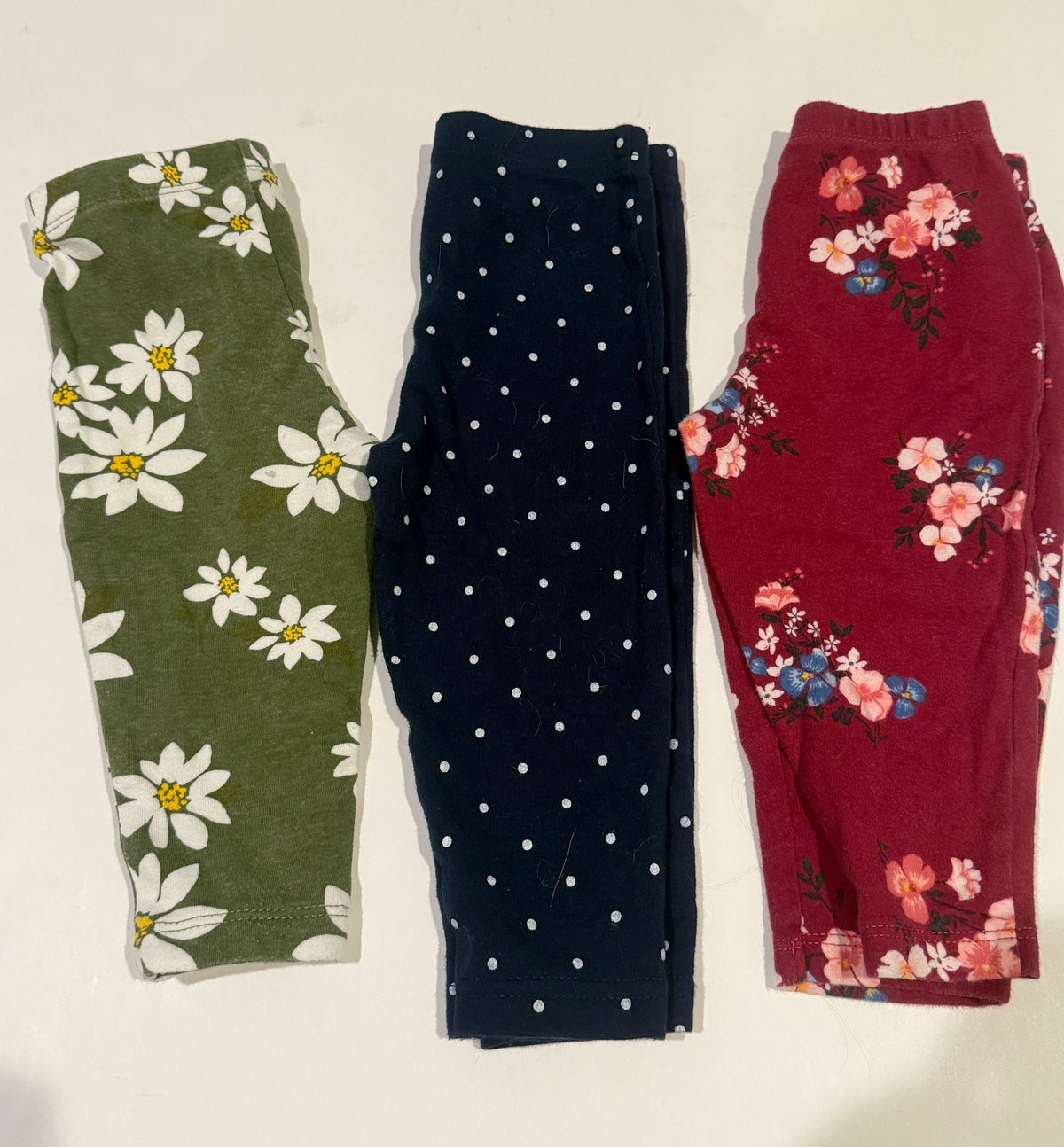 #170 Carters leggings bundle (3) green with white flowers, navy with white polka dots and maroon floral girls 9 months
