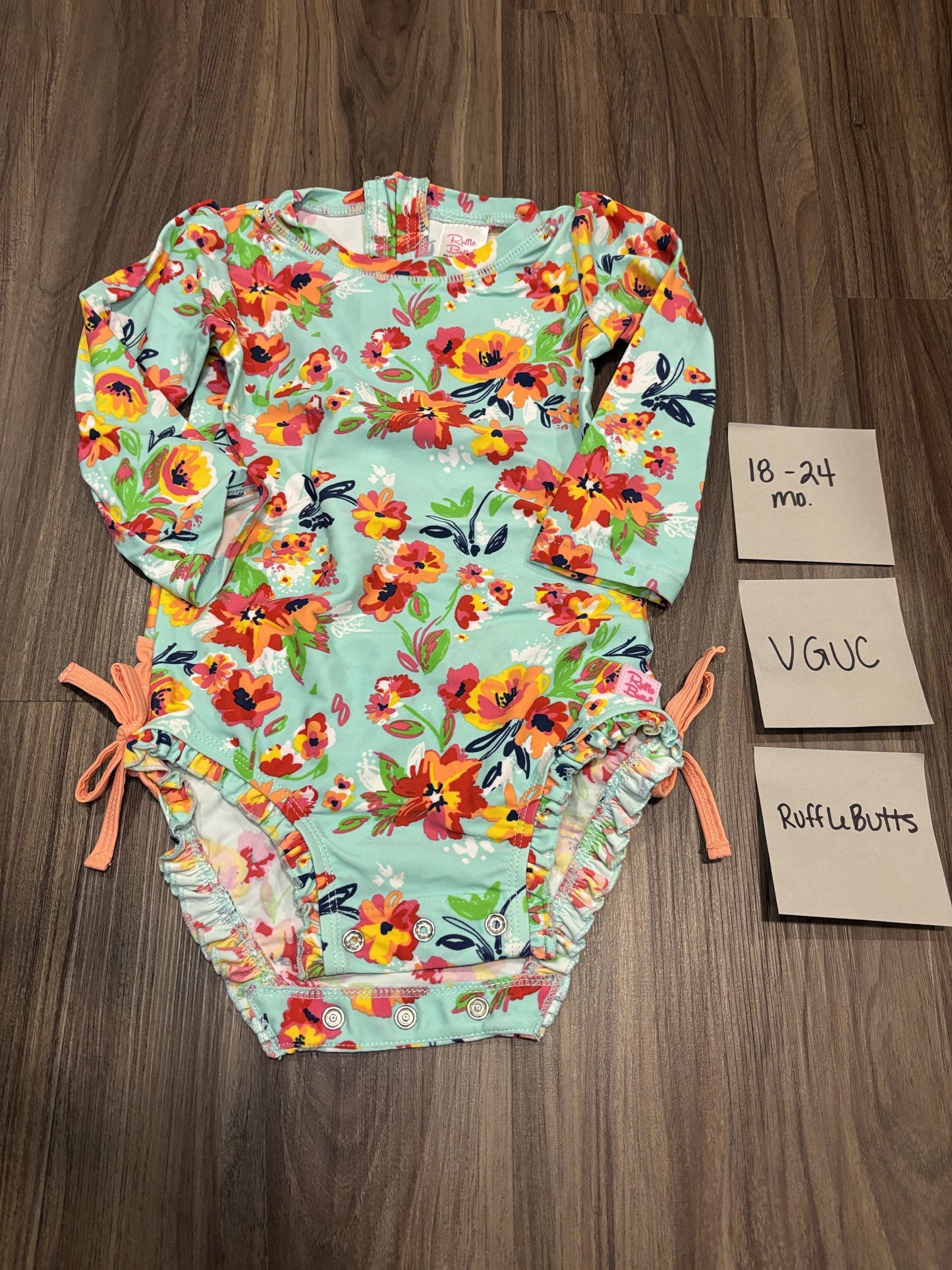 #77 - 18-24 Mo - VGUC RuffleButts - Teal/Orange Floral Rashguard