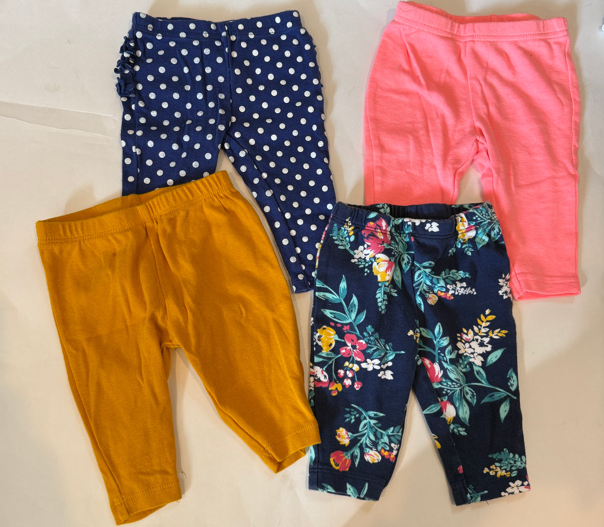 #170 Carters pants bundle (4)— yellow, blue and white polka dot ruffle bottom, floral and coral girls 3 months