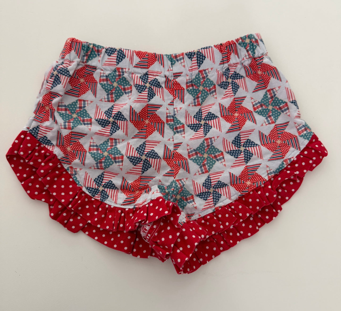 *reduced* #117, Girls 2T, Boutique red, white, & blue pinwheel shorts, GUC