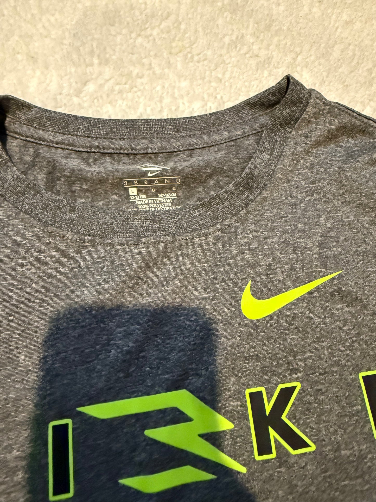 136 EUC Boys Nike Athletic material shirt size L (10/12)