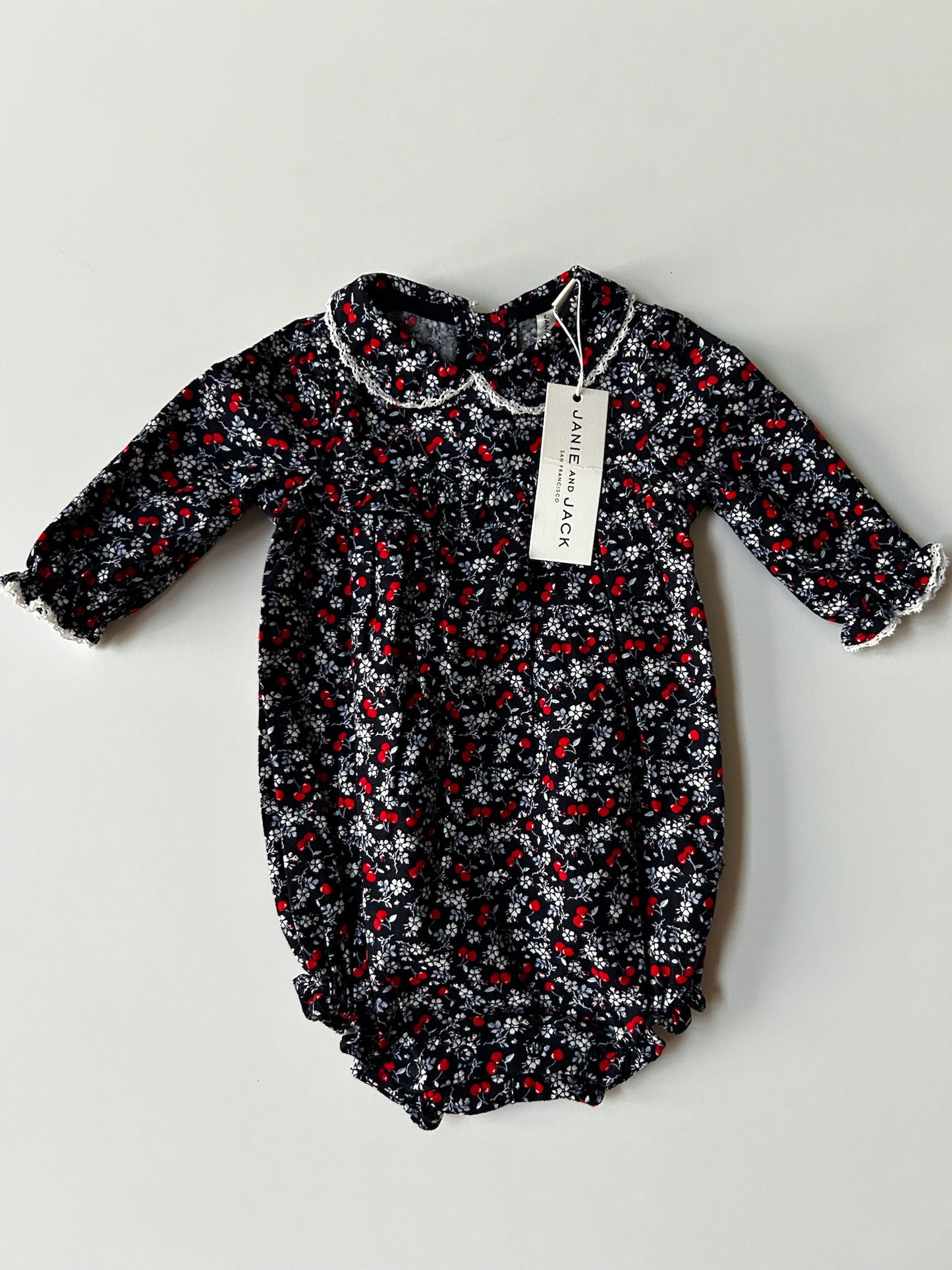 #98A - NWT 3-6M Girls Janie and Jack Navy Blue Cherry Bubble Romper (retail $49)